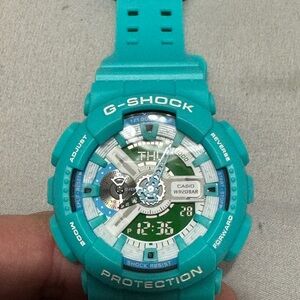 G-Shock Turquoise and Green Watch